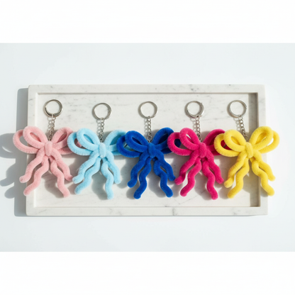 5 Chenille Bow Keychains on White Marble Tray